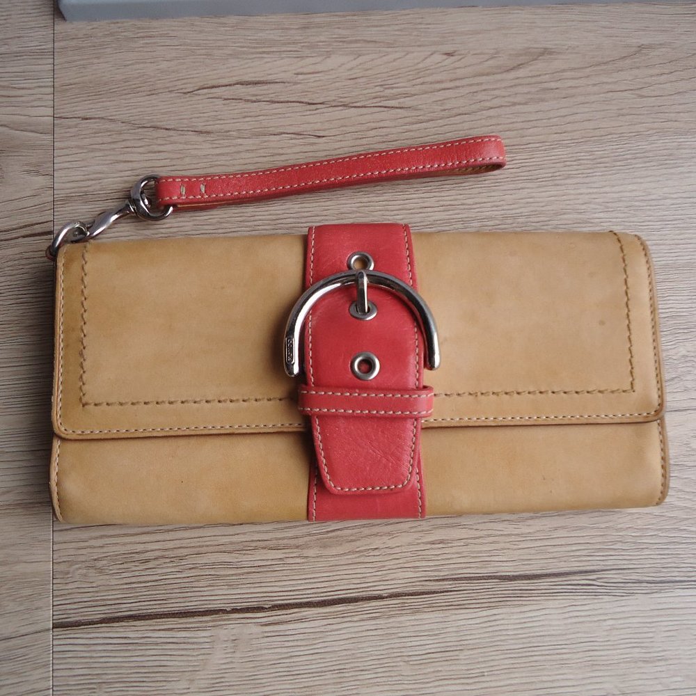 Coach Vachetta leather buckle wristlet wallet.